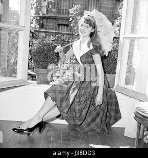 Brigitte Bardot in the appartment where she lives with her husband Roger Vadim,  Boulevard Exelmans in Paris. c.1953-1954 Photo Georges Rétif de la Bretonne  Photo12 does not manage Brigitte Bardot copyright. For all non editorial use, an atuhorization must be asked to Open Art Productions. Open Art Productions 9, rue des Suisses 92380 Garches, France +33(0)1 41 38 85 85 Stock Photo