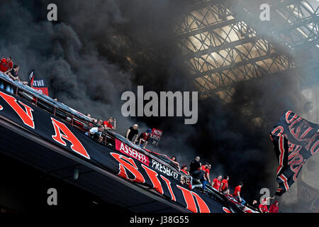 AC Milan's fans cheering at the San siro football stadium, in Milan. Stock Photo