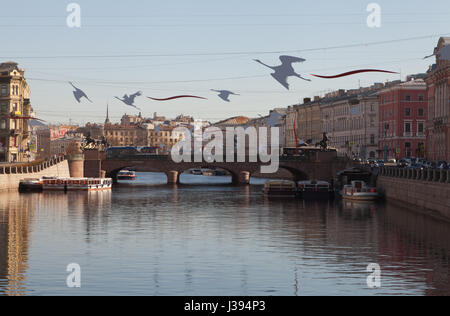The romantic composition 'Cranes', created on the eve of the Victory Day. Anichkov Bridge, Embankment of the Fontanka River, St. Petersburg, Russia. Stock Photo