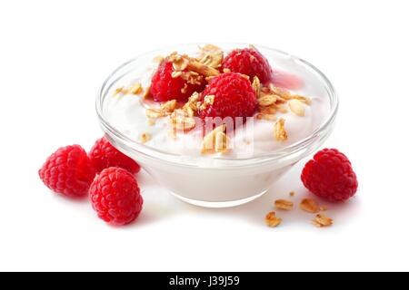 Clear bowl of raspberry flavored yogurt with granola and berries over a white background Stock Photo