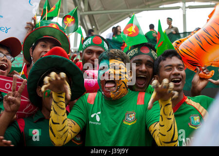 Jubilant cricket fans during the match of the 10th ICC Cricket World Cup at Sher –E- Bangla National Cricket Stadium. Dhaka, Bangladesh. Stock Photo