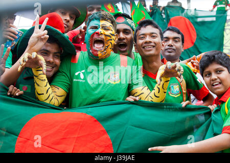 Jubilant cricket fans during the match of the 10th ICC Cricket World Cup at Sher –E- Bangla National Cricket Stadium. Dhaka, Bangladesh. Stock Photo