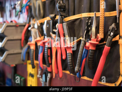 Variety tools on garage wall Stock Photo