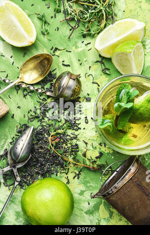 Dry tea leaves,fresh thyme,lime fruit for tea Stock Photo
