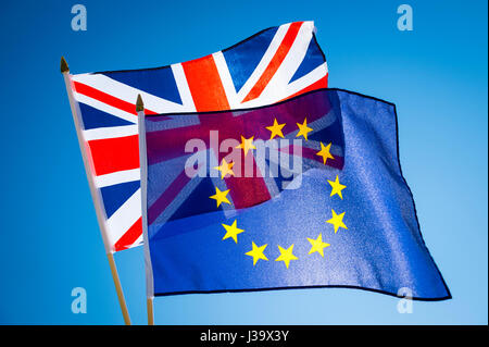 EU European Union and Scottish flags flying together in Brexit solidarity in bright blue sky Stock Photo