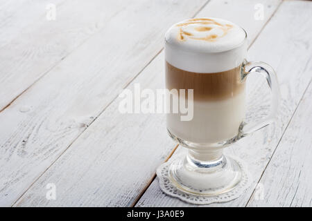 latte macchiato coffee on white wooden background Stock Photo