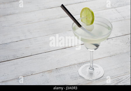 margarita cocktail with lime on white woodenbackground Stock Photo