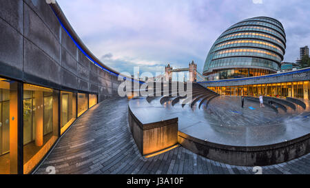 LONDON, UNITED KINGDOM - OCTOBER 7, 2014: London City Hall and Tower Bridge in London, UK. The City Hall has an unusual, bulbous shape, was designed b Stock Photo