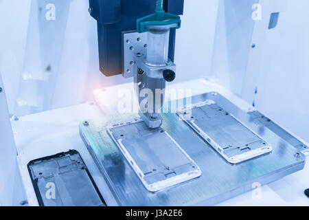 artificial intelligence machine working in phone factory Stock Photo