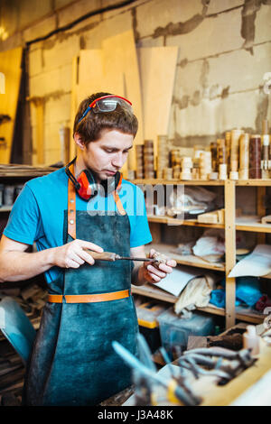 Carpenter Working in Studio Stock Photo
