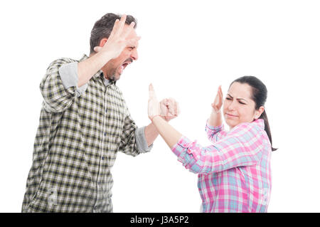 Married couple having a fight or altercation as domestic violence concept isolated on white Stock Photo