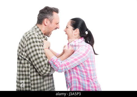 Couple having a screaming fight and disagreements looking mad isolated on white Stock Photo