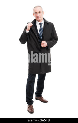 Full body of middle age business man wearing elegant raincoat isolated on white background Stock Photo