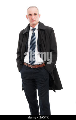 Middle age business man posing wearing elegant raincoat isolated on white background Stock Photo