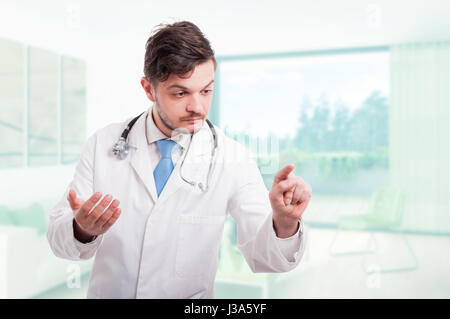 Professional doctor touching with finger a modern interface in his office with copytext space Stock Photo