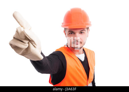 Young serious workman making refusal sign with his finger on white background as warning concept Stock Photo