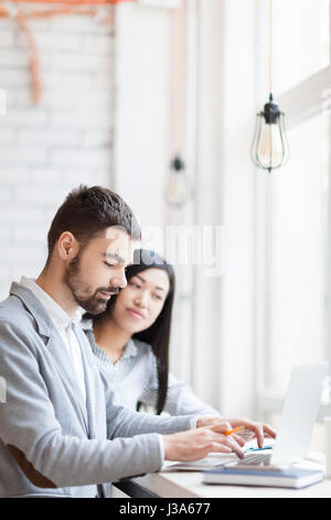 Brainstorming on Joint Project in Coffeehouse Stock Photo