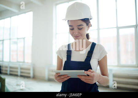 Female Construction Worker Using Tablet Stock Photo