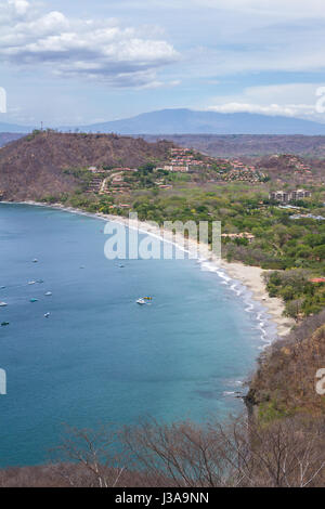 beautiful view of Hermosa Bay in Guanacaste Costa Rica, with deep blue water and white sand