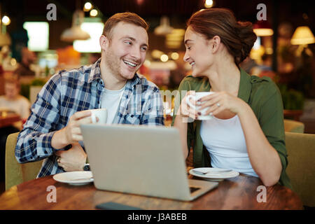 Couple Having Good Time in Cafe Stock Photo