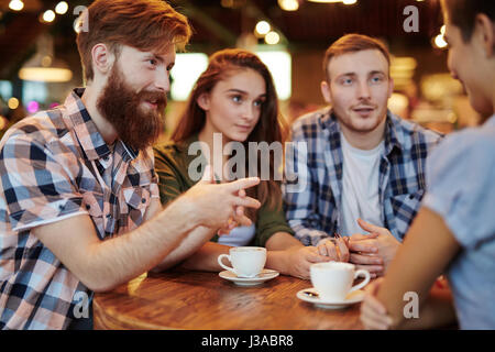 Discussing Joint Project with Colleagues Stock Photo