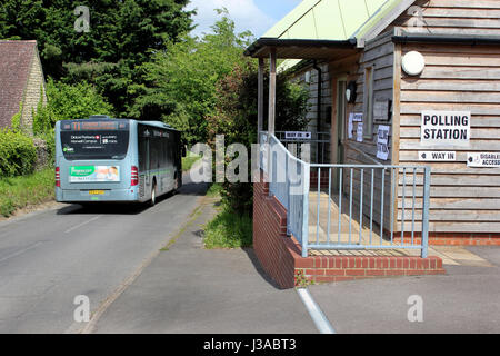 Local bus passes Garsington Village Hall polling station for the local council elections Oxfordshire Stock Photo