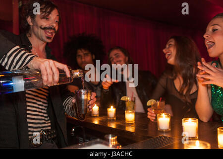 Bartender serving drinks at a nightclub Stock Photo