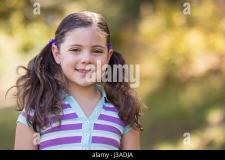 Close up portrait of cute girl on sunny day Stock Photo