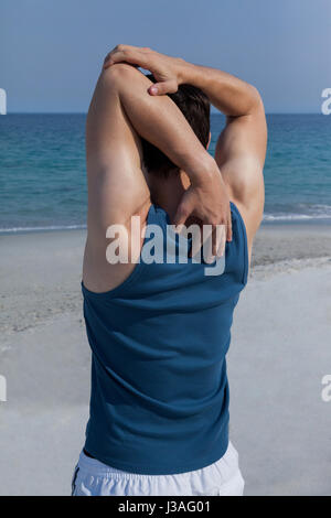 Rear view of muscular man doing pull ups Stock Photo - Alamy