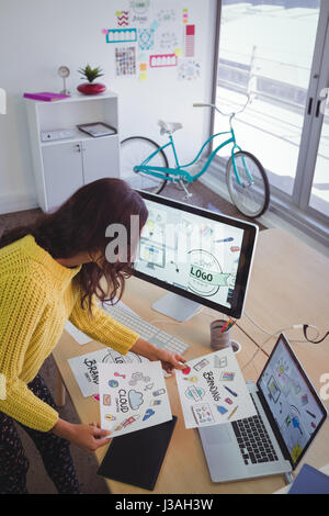 High angle view of female graphic designer working at office desk Stock Photo