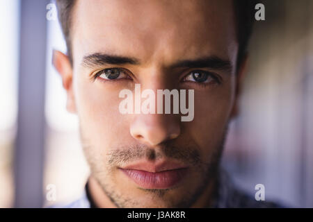Extreme close up portrait of confident businessman in office Stock Photo