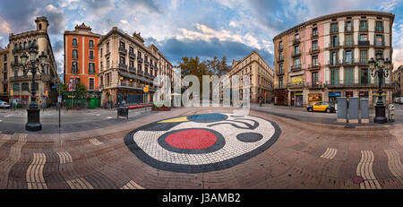 BARCELONA, SPAIN - NOVEMBER 17, 2014: Joan Miro's Pla de l'Os mosaic in La Rambla in Barcelona, Spain. Thousands of people walk daily on the mosaic, d Stock Photo