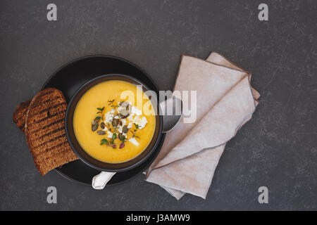 Roast pumpkin soup with pumpkin seeds.  Top view, blank space Stock Photo