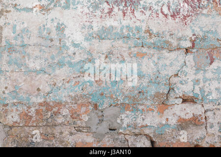 Paint chipped brick textured wall, close up Stock Photo