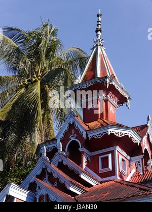 Beautiful unique red house with turret and  fancy eaves in Mawlamyine, Mon State, once capital of British Burma, one-time home to Orwell and Kipling Stock Photo