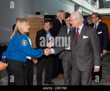 His Majesty The King of Sweden King Carl XVI Gustaf, right, is welcomed by NASA astronaut Kay Hire during a visit by a Swedish Delegation to the Goddard Space Flight Center May 3, 2017 in Greenbelt, Maryland. Stock Photo