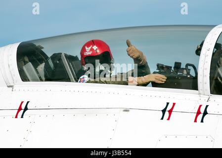 Travis, California, USA. 4th May, 2017. Former hero airline pilot Chesley Sully Sullenberger III gives a thumbs up from inside the cockpit before a flight with the USAF Thunderbirds at Travis Air Force Base May 4, 2017 in Travis, California. Sullenberger is a 1973 Air Force Academy graduate and is best known for successfully landing a crippled airliner in the Hudson River saving the lives of a 155 passengers. Credit: Planetpix/Alamy Live News Stock Photo