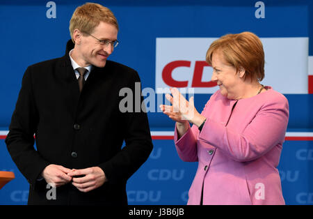 Eckernforde, Germany. 05th May, 2017. German Chancellor Angela Merkel stands next to the CDU's lead candidate for the 07 May Landtag (state parliament) election, Daniel Gunther, during a CDU campaign event in in Eckernforde, Germany, 05 May 2017. Photo: Carsten Rehder/dpa/Alamy Live News Stock Photo