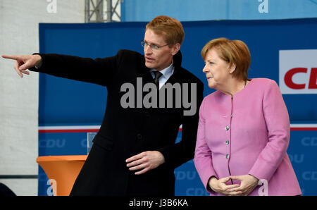 Eckernforde, Germany. 05th May, 2017. German Chancellor Angela Merkel stands next to the CDU's lead candidate for the 07 May Landtag (state parliament) election, Daniel Gunther, during a CDU campaign event in in Eckernforde, Germany, 05 May 2017. Photo: Carsten Rehder/dpa/Alamy Live News Stock Photo