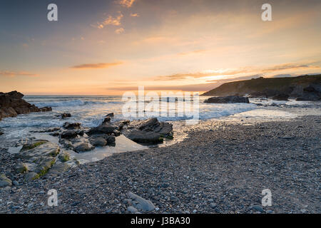 Sunset at Church Cove near Gunwalloe on the Cornwall Coast Stock Photo