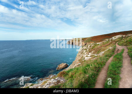 The South West Coast Path as it approaches the cliffs at Rinsey Head near Porthleven in Cornwall Stock Photo