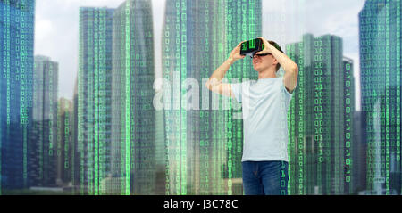 happy man in virtual reality headset or 3d glasses Stock Photo