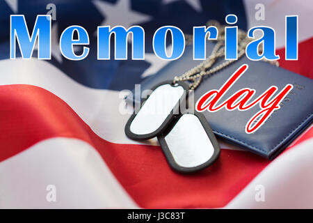 memorial day words on american flag and dog tags Stock Photo