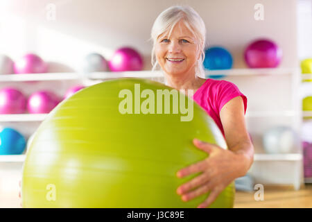 Seniors doing fitness exercises Stock Photo