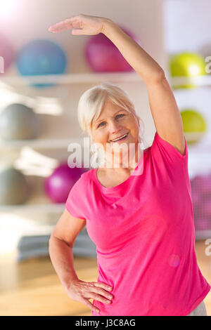 Seniors doing fitness exercises Stock Photo