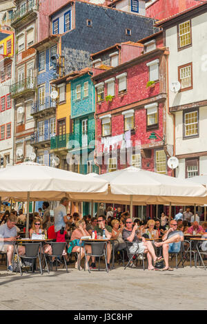 Porto Portugal bar, view of tourists at a bar in the Ribeira waterfront area enjoying refreshment on a summer afternoon, Porto, Portugal, Europe Stock Photo