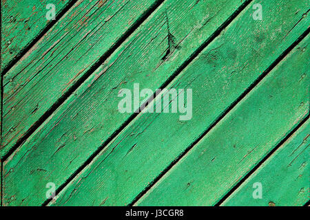 A fragment of an old, painted, green wooden surface Stock Photo