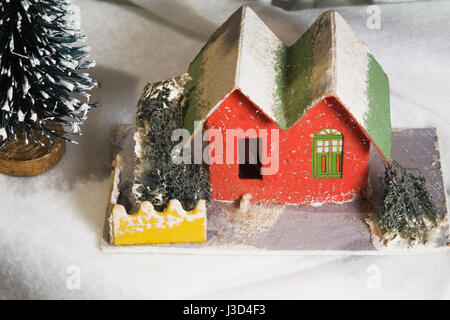 Close-up of Christmas tree ornaments on a artificial snow background Stock Photo