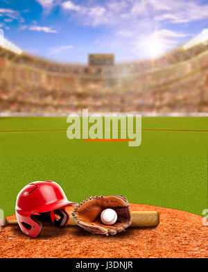 Sunset on baseball stadium full of fans in the stands with baseball helmet, bat, glove and ball on infield dirt clay. Deliberate focus on foreground w Stock Photo