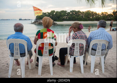 Singapore, Republic of Singapore, Asia, Tourists at Siloso Beach on Sentosa Stock Photo
